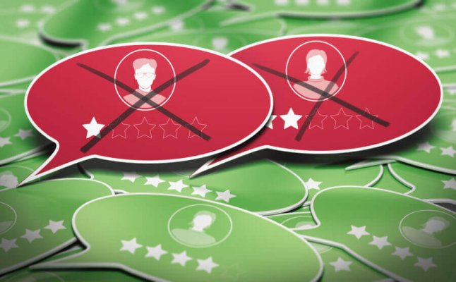 3D illustration of many speech bubbles with two negative business reviews removed. Concept of online reputation management.